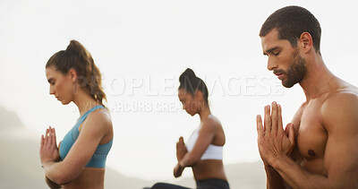 Buy stock photo Ocean, calm and meditation for group, outdoor and spiritual practice for wellness, peace and relax. Sea, chakra and self awareness for people, zen and yoga with mindfulness benefits or namaste