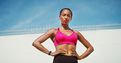 Buy stock photo Fitness, woman and portrait with break, exercise space and sweat with low angle. Athlete, confident and blue sky mockup for performance, body goals and serious outdoors for summer sports and wellness