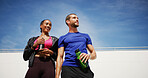 Outdoor, thinking and couple with fitness, water bottle and confidence with break, wellness and challenge. People, man and woman in city, exercise and training with workout, hobby or bonding together