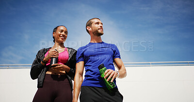 Buy stock photo Outdoor, thinking and couple with fitness, water bottle and confidence with break, wellness and challenge. People, man and woman in city, exercise and training with workout, hobby or space with sky