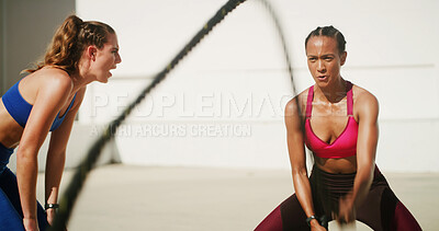 Buy stock photo Fitness, coach and woman with battle ropes for workout, exercise or body health. Muscle, personal trainer and bodybuilder with motivation for strength, speed and cardio challenge in city with blur