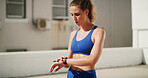 Fitness, woman and check smart watch outdoor for exercise progress, health performance and training biometric. Rooftop, athlete or wristwatch for tracking time, heart rate or measure workout calories