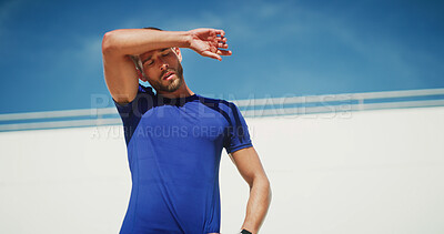 Buy stock photo Man, runner and tired on sweat, outdoor and breathing for wellness with low angle in summer. Person, athlete and training with rest, exhausted and recovery for workout, exercise and fatigue in France
