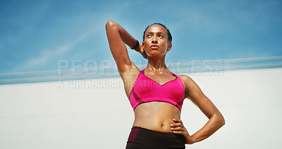 Buy stock photo Fitness, woman and stretching with break, exercise space and sweat with wellness. Athlete, thinking or blue sky mockup for performance, body goals and serious outdoors for summer sports and low angle