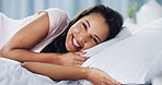 Happy, relax and portrait of woman in bed for leave, holiday or morning with peace and calm. Smile, confident and face of female person from Brazil in bedroom for rest on vacation in rental home.