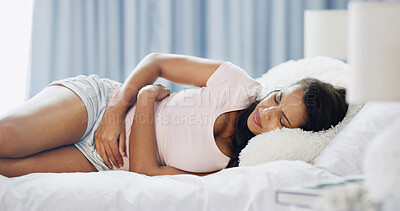 Buy stock photo Woman, sickness and worry in bed with stomach pain, menstruation cramps and IBS symptoms. Girl, stress and discomfort in home bedroom with tummy ache, endometriosis and fetal position for relief