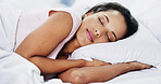 Sleeping, dreaming and woman in bed in home with relaxing on leave, free time or holiday. Calm, peace and female person with comfortable afternoon nap for fatigue on weekend in bedroom at house.