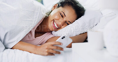Buy stock photo Laughing, morning or woman with phone in bed for dating website, funny joke or social media meme. Wake up, happy or person with online comedy in home for status update, text message or notification