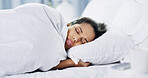Sleeping, bad dream and woman in bed in home with relaxing on leave, free time or holiday. Calm, peace and female person with afternoon nap for weekend with horror nightmare in bedroom at house.