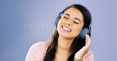 Buy stock photo Girl, happy and headphones for music in studio, streaming and subscription for playlist by background. Gen z woman, audio and listening with sound, song and smile for memory with mock up space