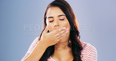Buy stock photo Woman, hand and tired yawn in studio with burnout, fatigue or overworked on blue background. Sleepy, low energy and female person with eyes closed for exhaustion, bored or covering mouth for insomnia