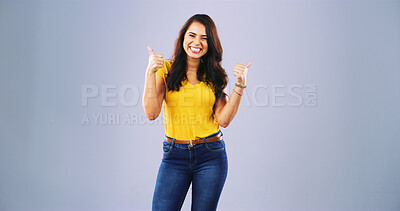 Buy stock photo Portrait, smile and thumbs up with student woman in studio for motivation, success or thank you. Education, well done and winner with happy person on gray background for college or university study