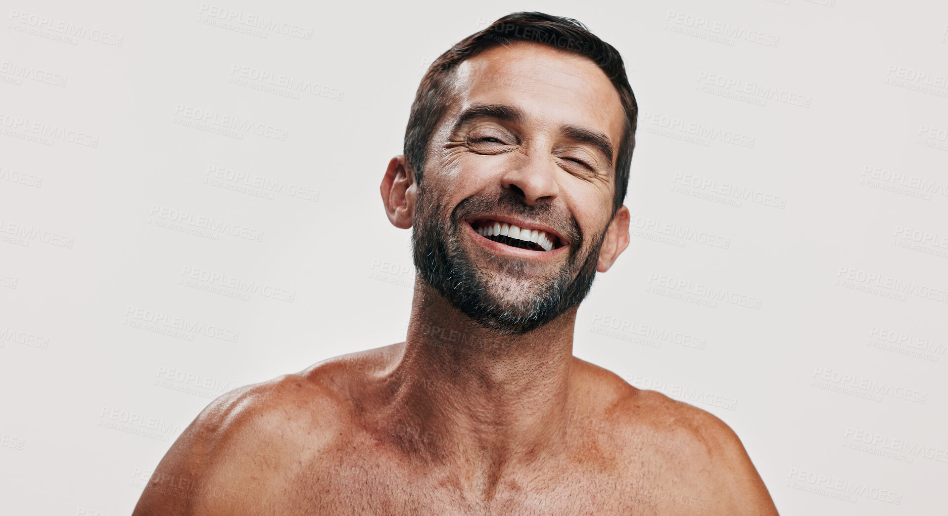 Buy stock photo Beauty, laughing and portrait of man in studio for antiaging treatment or dermatology. Topless, cosmetics and skincare with funny model isolated on white background for satisfaction or self care