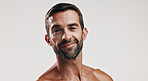 Portrait, pride and man for skincare in studio of facial glow,  natural cosmetic and treatment results. Male person, beauty and hair growth of grooming routine, dermatology shine and white background