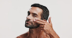 Lotion, skincare or portrait of man in studio for beauty glow, grooming and dermatology. Antiaging cosmetics, male model and person on white background for facial treatment, face cream or collagen