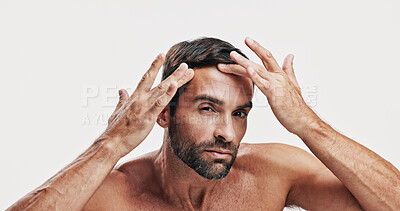 Buy stock photo Beauty, portrait and man check skincare for dermatology routine, self care and glow on white studio background. Natural, facial treatment and male model with cosmetics, face inspection and grooming