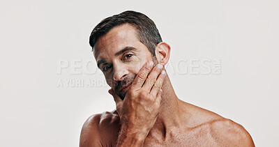 Buy stock photo Beauty, inspection and portrait of man in studio for antiaging treatment or dermatology. Aesthetic, cosmetics and skincare model checking face, isolated on white background for self care routine