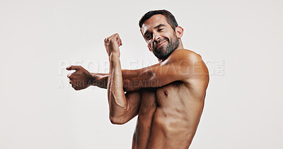 Buy stock photo Fitness, happy and man with stretching in studio for muscle workout, body care or sports exercise on mockup space. Bodybuilder, arm warm up or training for performance or topless on white background
