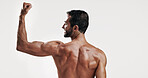 Power, flexing and back of man in studio with body building workout for fitness progress. Motivation, biceps and male person with flexing strong arms for training or exercise by white background.