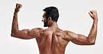 Muscles, strong and back of man flexing in studio with body building workout for fitness progress. Motivation, biceps and male person with strength in arms for power training by white background.