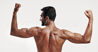 Buy stock photo Muscles, strong and back of man flexing in studio with body building workout for fitness progress. Confident, biceps and topless person with strength in arms for power training by white background.