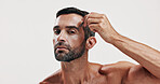 Portrait, man and beauty with tweezer in studio of hair removal, maintenance and facial growth. Person, tools and grooming routine of eyebrow hygiene, self care and transformation on white background
