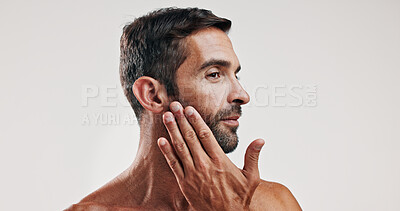 Buy stock photo Man, touch and beard for skincare in studio with facial glow,  natural cosmetic and treatment results. Male person, beauty and hair growth for grooming routine, dermatology and white background space