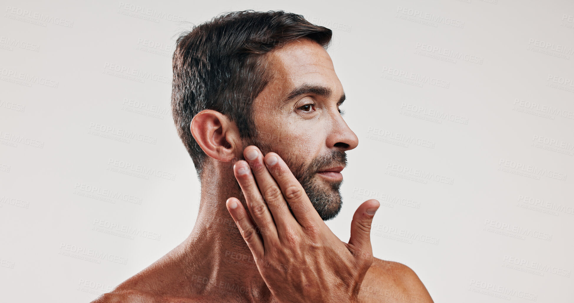 Buy stock photo Man, touch and beard for skincare in studio with facial glow,  natural cosmetic and treatment results. Male person, beauty and hair growth for grooming routine, dermatology and white background space