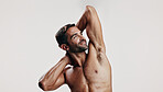 Confident, flexing and man in studio with body building workout for fitness progress. Mockup space, biceps and male person with strong arms for power training results or thinking on white background