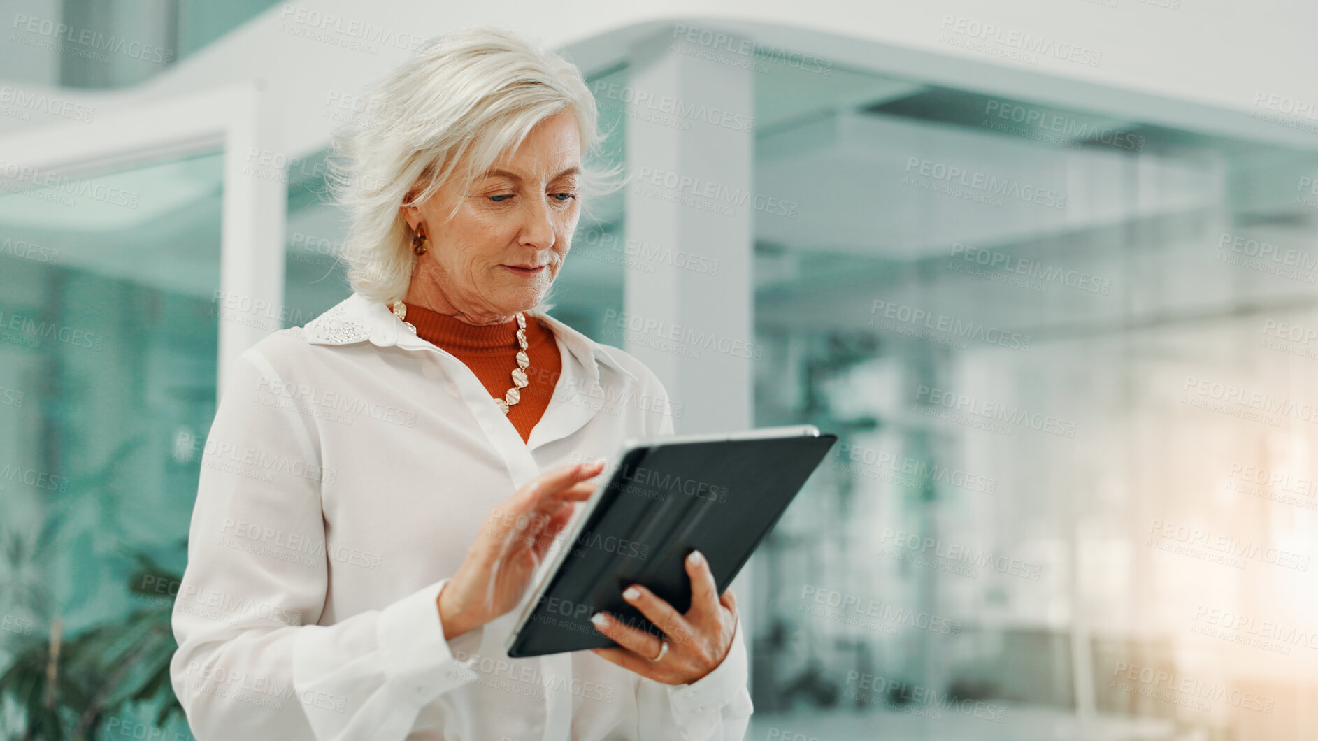 Buy stock photo Mature woman, reading and tablet in office for business, scroll email and check news on economy. Digital technology, internet and finance manager on app for investment, profit and risk management