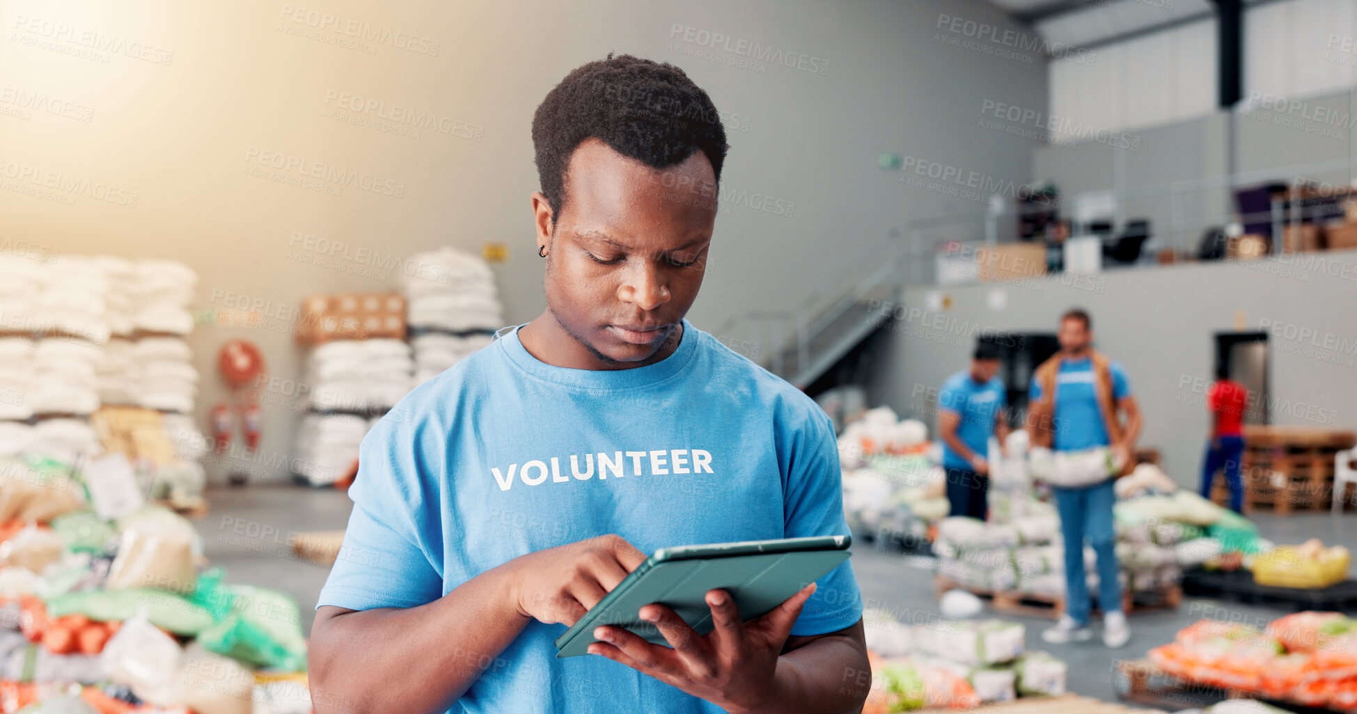 Buy stock photo Volunteer, donation and tablet with man in warehouse for non profit, inventory checklist and humanity project. Charity, social responsibility and food bank program with person in factory for ngo plan