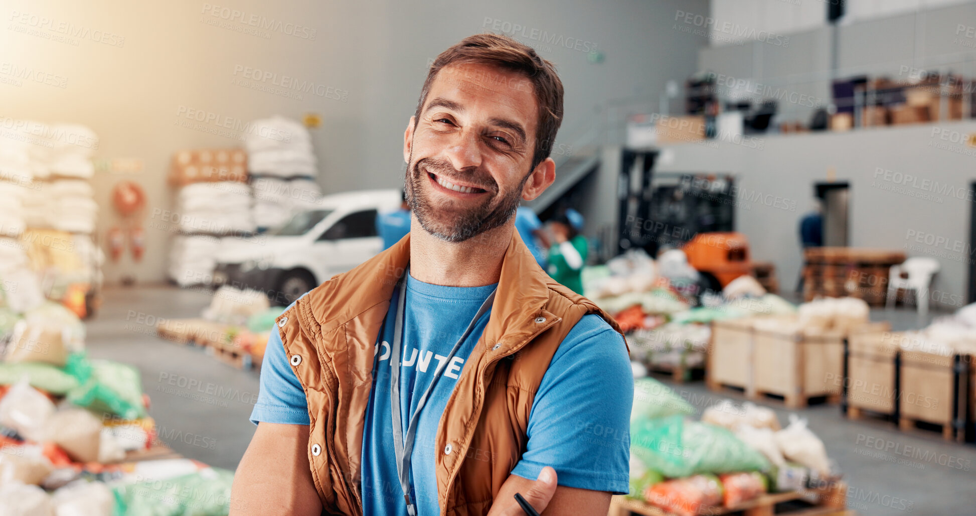 Buy stock photo Confident, man and portrait of volunteer at food drive for charity, donation or non profit event. Happy, activism and face of male NGO worker at community center for help in society at workshop.