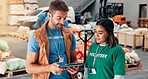 Volunteer, team and tablet with people in warehouse for non profit, inventory checklist and donation. Charity, social responsibility and food bank program with man and woman in factory for ngo plan