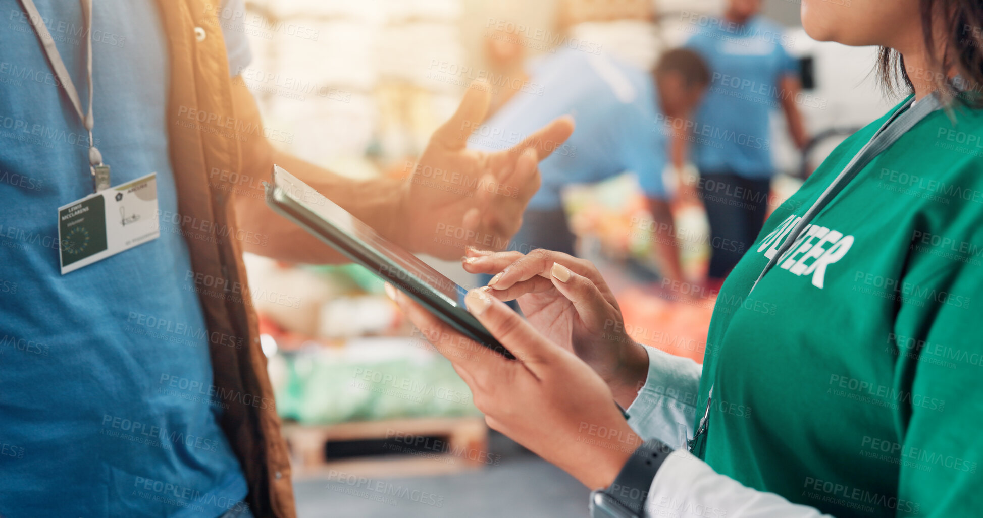 Buy stock photo Hands, tablet and volunteers for charity, help and review of donations on website or discussion. Social responsibility, closeup and people in warehouse with supplies for community service or NGO team