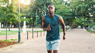 Buy stock photo Running, fitness and black man in park for workout, marathon training and exercise on outdoor path. Sports, athlete and person for performance, endurance and challenge for health, wellness and cardio
