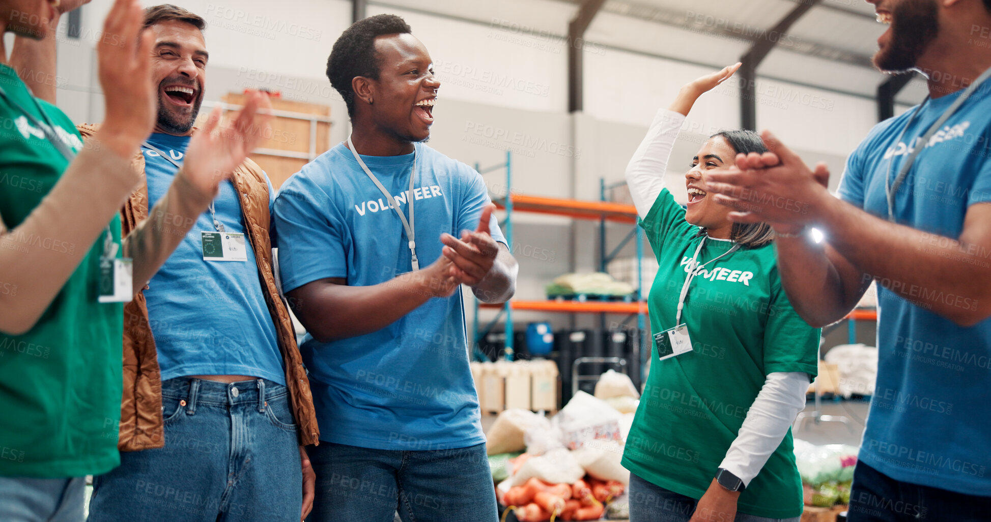 Buy stock photo Volunteer group, happy and celebration with applause in warehouse for outreach success or community service. NGO, social responsibility or excited people with food drive target or charity achievement