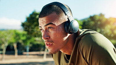Buy stock photo Runner, tired and man with headphones at park with running fatigue, cardio challenge or breathing break. Fitness, athlete or exhausted in nature with resting, sports recovery or workout music outdoor