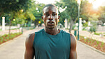 Fitness, tired and black man with portrait at park for workout recovery, running fatigue and training break. Athlete, serious and breathing in nature for exercise challenge, cardio rest and sweating