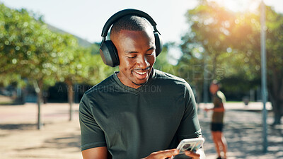 Buy stock photo Outdoor, black man and music with smartphone for fitness, training and confidence with audio track. Nature, male person and runner with headphones to listen, radio and mobile with song for exercise