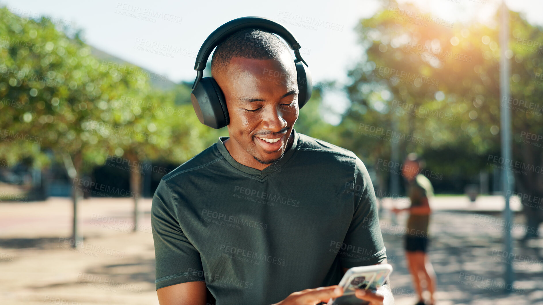 Buy stock photo Outdoor, black man and music with smartphone for fitness, training and confidence with audio track. Nature, male person and runner with headphones to listen, radio and mobile with song for exercise