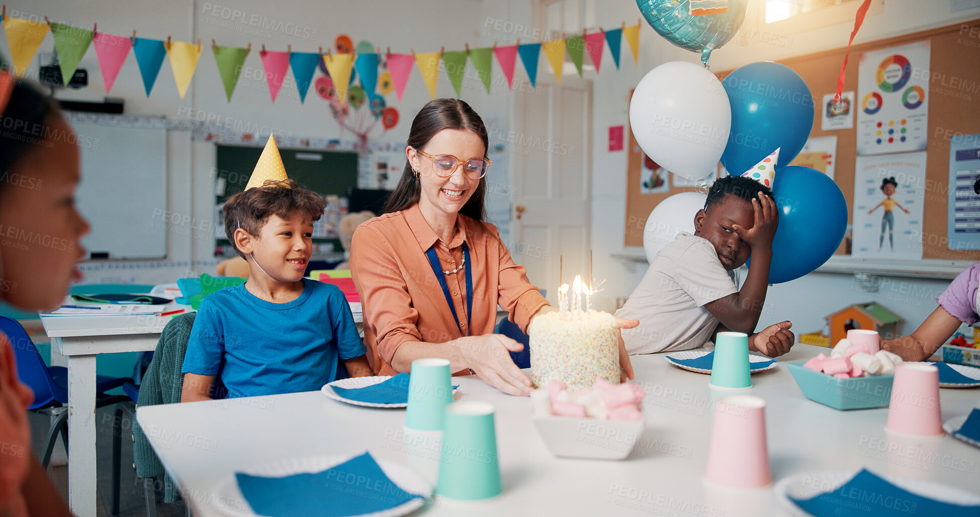 Buy stock photo Birthday, cake and children with teacher in classroom for group party with dessert, hats and decoration. Happy, candles and woman educator with kid students for celebration of special event at school