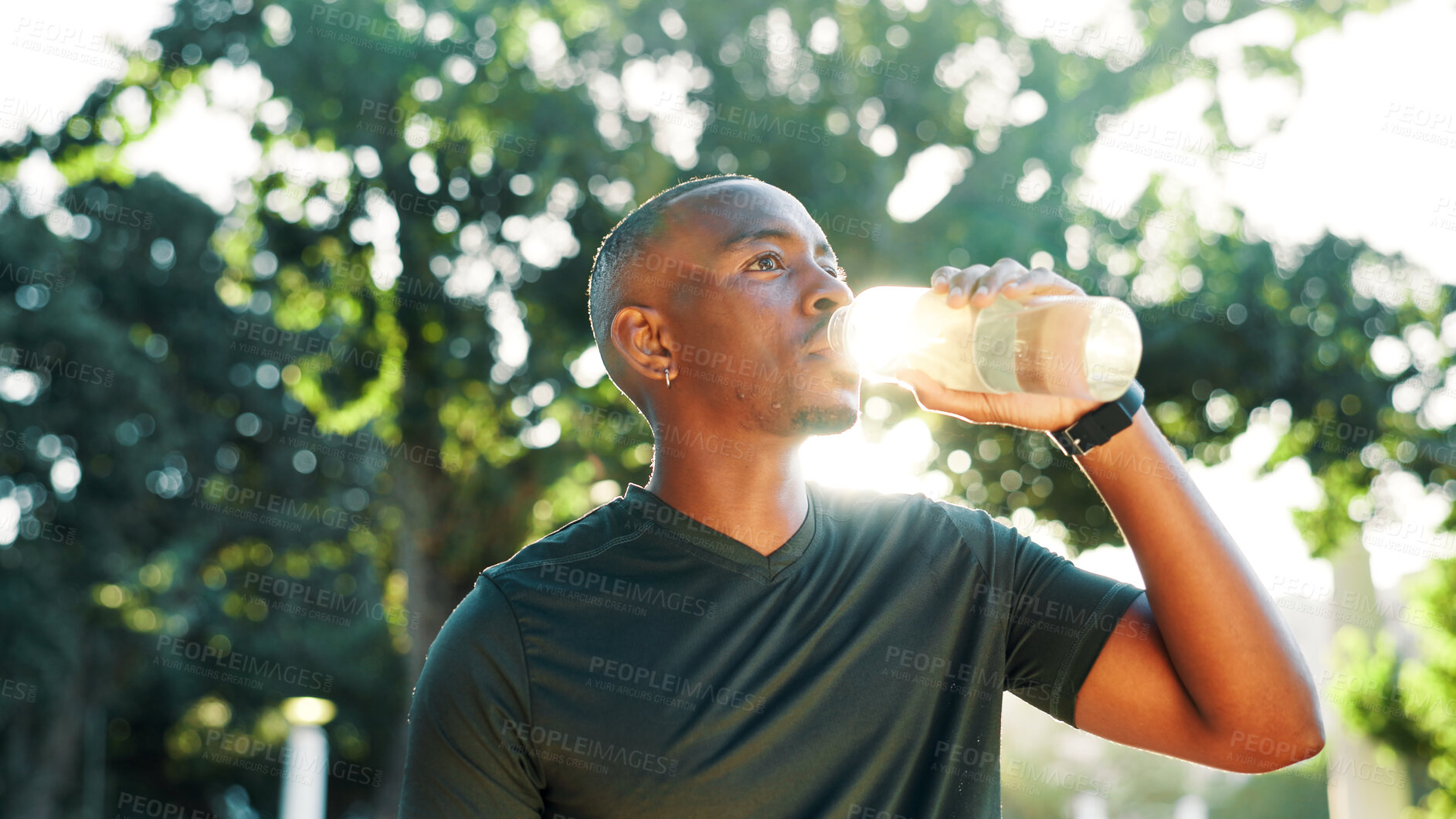 Buy stock photo Outdoor, black man and fitness with drinking water for wellness, hydration and nutrition with mineral. Nature, male person and runner with exercise break for h2o liquid, health and thirsty by flare