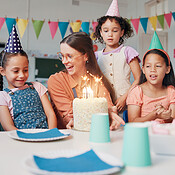 Children, teacher and birthday cake for celebration in classroom with ...