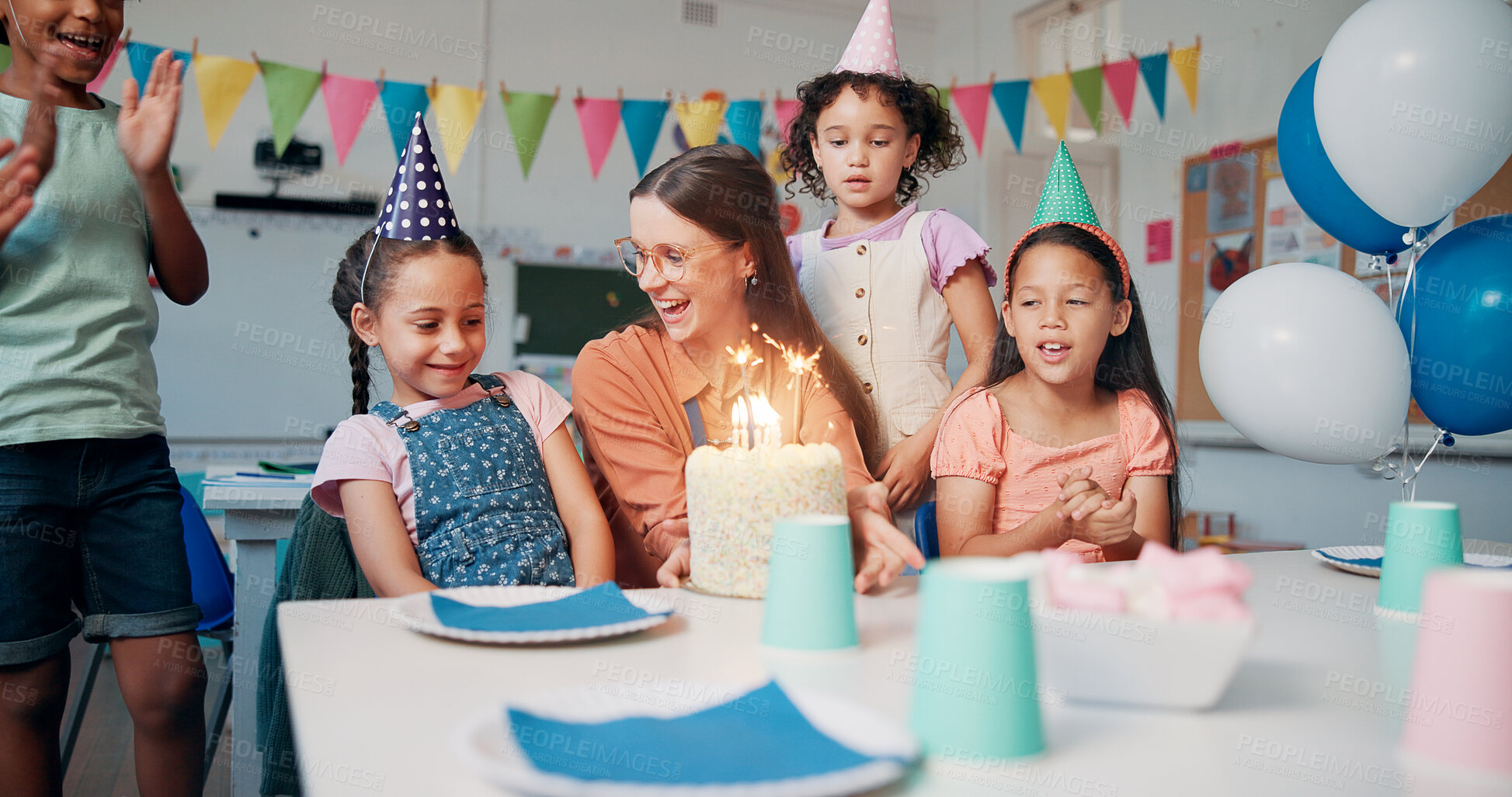 Buy stock photo Children, teacher and birthday cake for celebration in classroom with singing, party or social event. Friends, happy people and shy student at learning academy with applause or support on special day