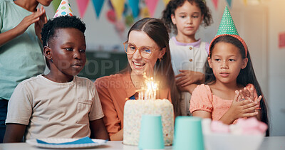 Buy stock photo Teacher, woman and children with birthday cake in classroom, happy and celebration with snacks at school. Person, kids and excited with smile for dessert, cheers and candle for party at academy