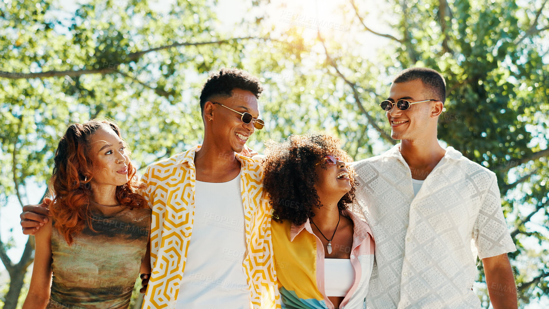 Buy stock photo Happy, group and people walk at park with social gathering, university break and bonding together. Couple of friends, talking and embrace with summer vacation, travel and reunion for streetwear style