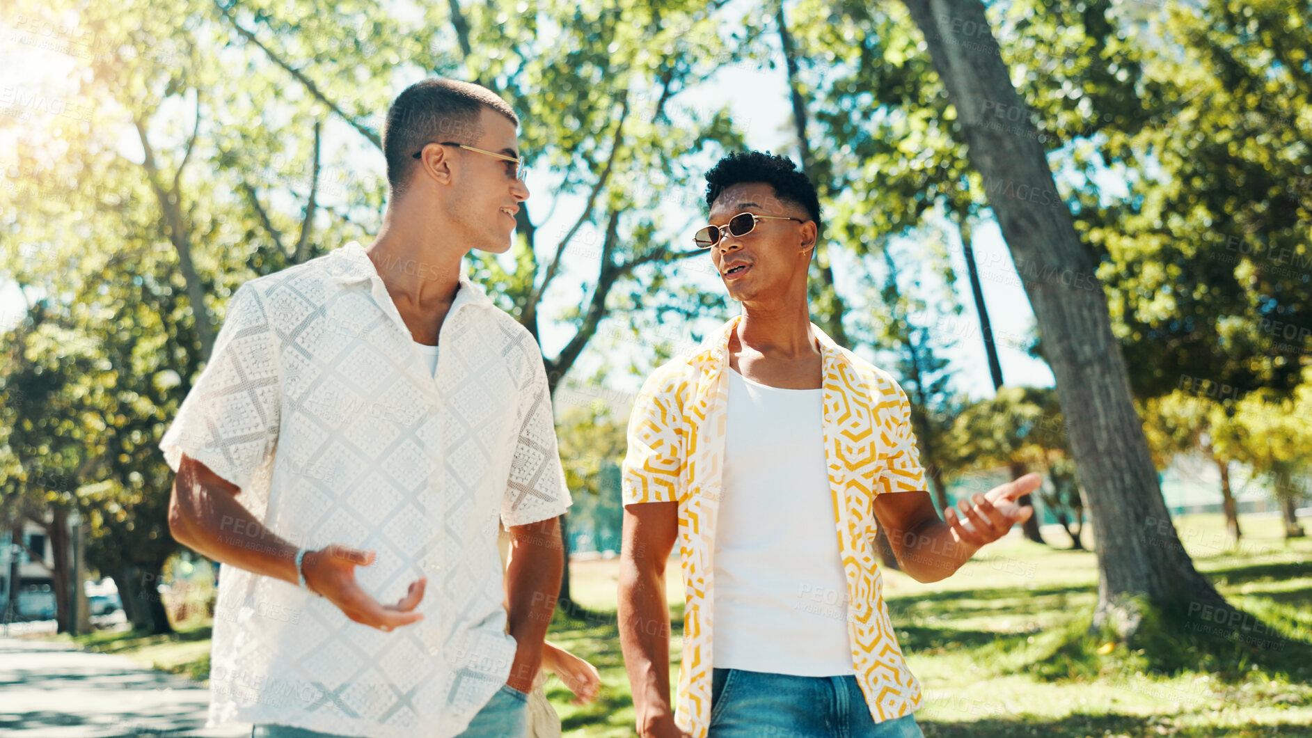 Buy stock photo Men, friends and talk at park outdoor for social gathering, university break and bonding together. People, explain and walk with streetwear clothes for summer holiday, travel journey and reunion trip