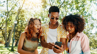 Buy stock photo Friends, phone and surprise with social media at park for online update, gossip post and drama news. Gen z people, shocked and smartphone with internet information, announcement or text notification