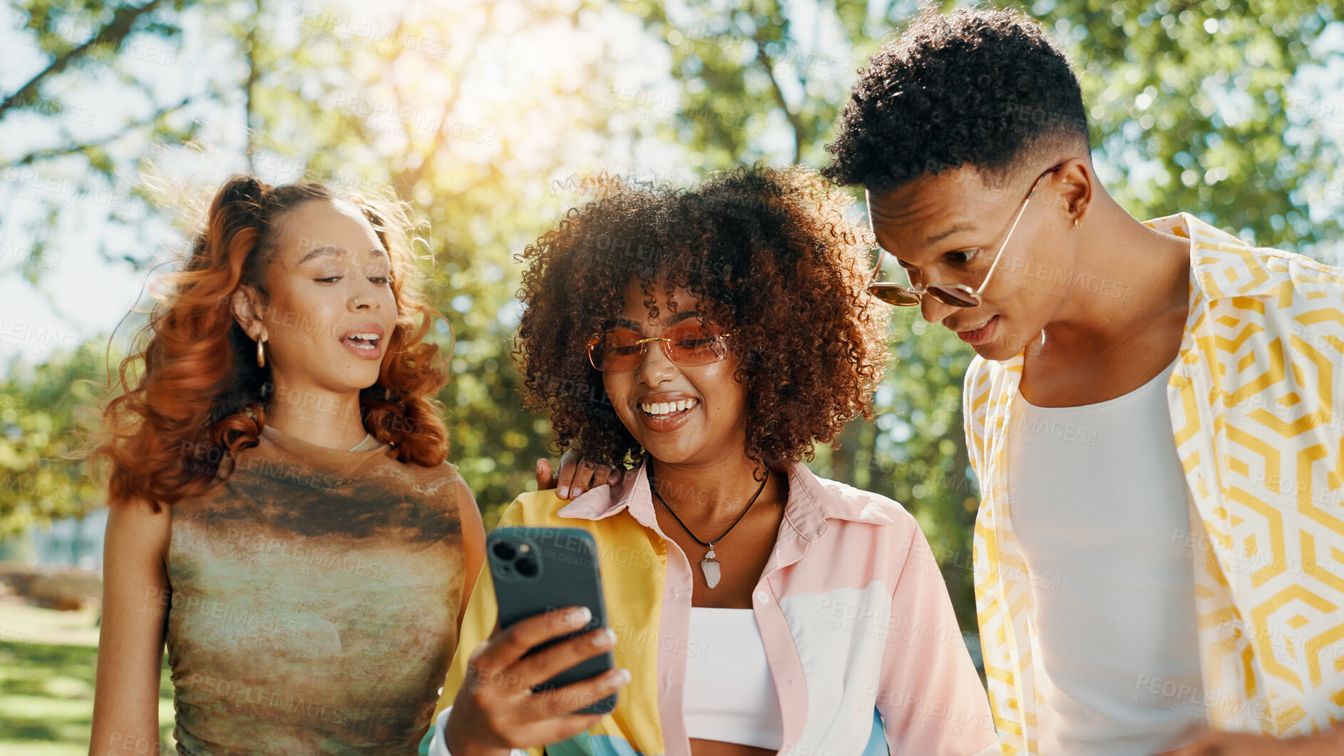 Buy stock photo Friends, happy and show phone at park for social media gossip, online drama and internet news. Gen z people, relax and smartphone with surprise information, web announcement and text notification