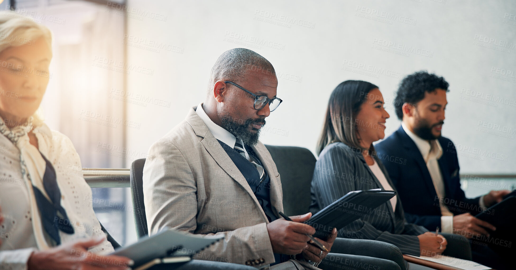 Buy stock photo Seminar, reading and man with documents, group and colleagues in workshop for training or meeting. Conference, information and coworkers with notes for presentation, audience and people in boardroom